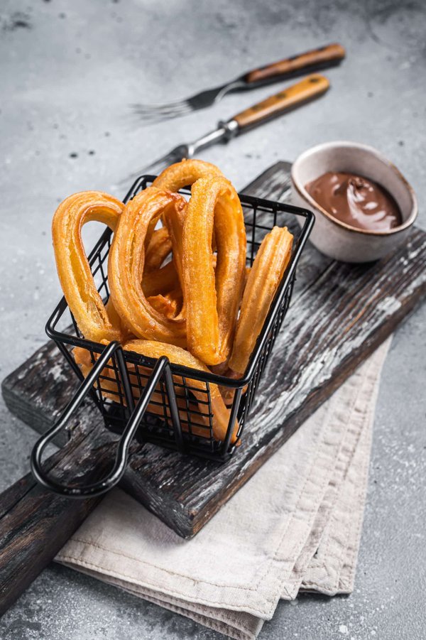 How to Prepare Authentic Churros with a Thick Chocolate Dipping Sauce?